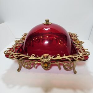 red acrylic plexi cake stand with bronze mounts and orange stones